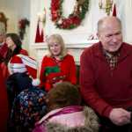 Gov. Bill Walker greets members of the Orca Singers from Auke Bay Elementary School with his wife, Donna, their grandson, Porter Hobson, 6, Lt. Gov. Byron Mallott and his wife, Toni, during the Governor's Open House on Tuesday.