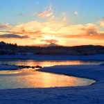 Fire and ice: The fiery setting sun reflects on the icy Mendenhall Lake on Dec. 5.