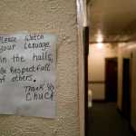 Signs in the hallway by the Bergmann Hotel's new manager.