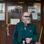 Charles Cotten Jr., the new manager of the Bergmann Hotel, surveys the front of the hotel on Wednesday, Nov. 30. Cotten says his plan of attack is simple. Step one: "Clean up the people." Step two: "Clean up the building."
