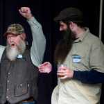 Jeff Boehm celebrates his win in the full beard competition during the second annual LumberJACC Beard & Moustache contest as fellow contestants Jacob Gemmbell, center, and Nick Rutecki look on at the Juneau Arts & Culture Center on Friday.