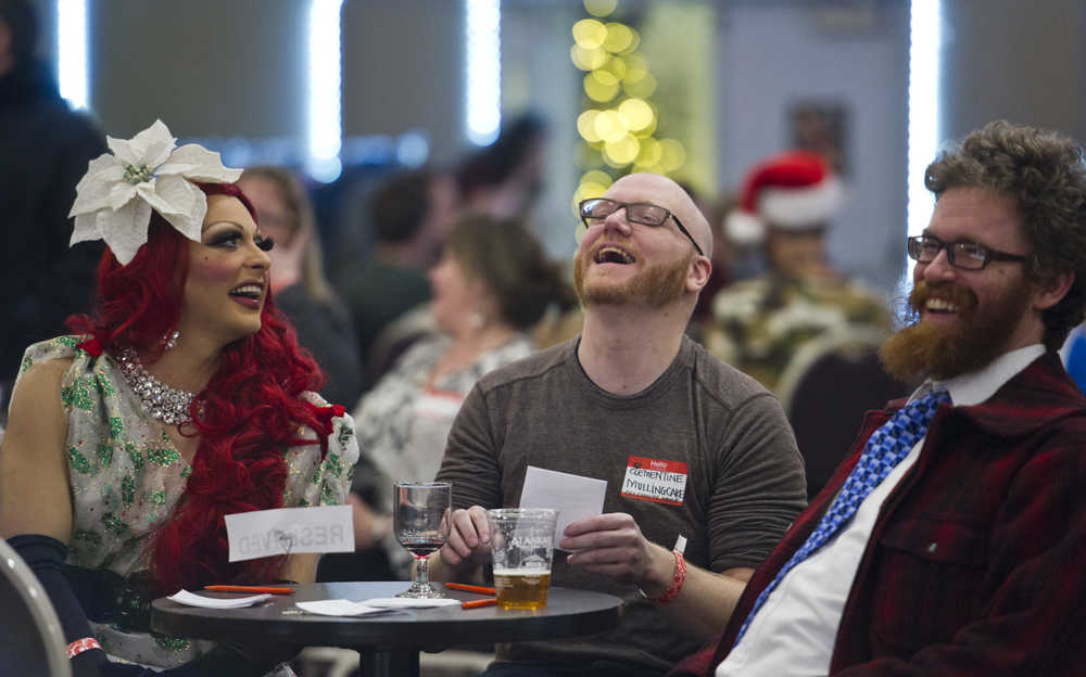 GiGi Monroe, left, Aaron Suring, center, World Beard & Moustache Contest champion, and Rep. Justin Parish judge the 2nd annual LumberJACC Beard & Moustache contest at the Juneau Arts & Culture Center on Friday, Dec. 9, 2016.