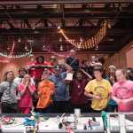 Brickbusters 3.0 and fans look on as their robot completes its mission during the 10th Annual Robot Jamboree competition. The competition was held Saturday afternoon at Centennial Hall.