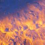 A colorful pile of snow at sunset.