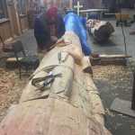 Master Carver Jonathan Rowan working on the Veterans Totem Pole.