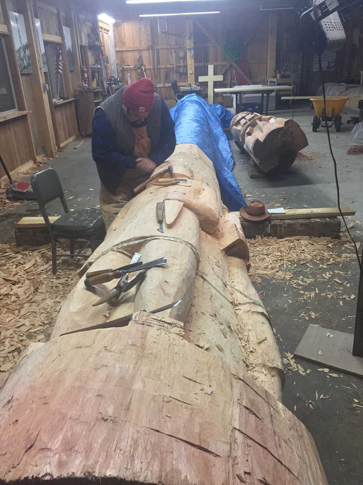 Master Carver Jonathan Rowan working on the Veterans Totem Pole.
