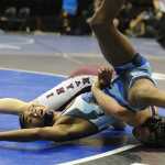 Jahrease Mays, of Thunder Mountain High, and Matthew Rodriguez, of Ketchikan High, compete in the 106 lb. class in the semifinals of the 4A Alaska State Wrestling Championships at the UAA Alaska Airlines Center in Anchorage, Alaska, on Friday, December 16, 2016. Rodriguez won the match with a pin. (Bob Hallinen / Alaska Dispatch News)