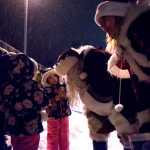 Savana Martinez, 4, speaks to firefighter EMT Steve Anderson, dressed as Santa Clause, as firefighter EMT Kristi Asplund, dressed as Mrs. Clause, talks with other children during Santa's Annual Ride with Capital City Fire/Rescue in the Mendenhall Valley at Glacier Valley Elementary School on Dec. 17, 2016. Santa's ride went throughout the Mendenhall Valley, and Capital City Fire/Rescue volunteers handed out candy canes. (Photo by Marlena Sloss).