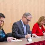 Jacqueline Tupou, left, former Gov. Sean Parnell, center, and Carolyn Leman cast their Electoral College votes as Election Coordinator Sharon Forrest, right, oversees the signing of the documents during a ceremony at the Alaska State Museum on Monday, Dec. 19, 2016.