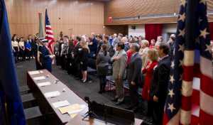 An honor guard from the U.S. Coast Guard presents the colors during the Electoral College vote casting ceremony at the Alaska State Museum on Monday, Dec. 19, 2016.