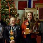 From left to right, pickled herring competition winners Sig Mathisen, Bob Olsen, Carolyn Kvernvik and Adam Swanson (standing in for his dad Rob) pose with their trophies.