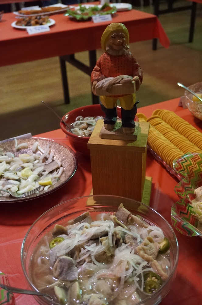 The much-sought-after pickled herring statue amidst the competing dishes.