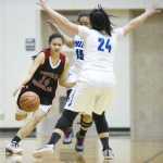 Juneau-Douglas' Alyxn Bohulano, left, dribbles against Palmer's Lorna Suaava (15) and Emma Ushmann during the Capital City Classic on Wednesday, Dec. 28, 2016.