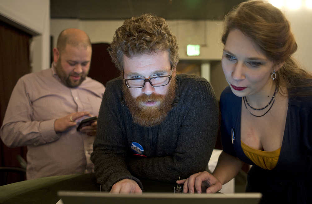 House District 34 candidate Justin Parish, center, watches results come in with campaign manager Steve SueWing, left, and volunteer Monica Todden at Rockwell on Tuesday, Nov. 8, 2016. Parish unseated Rep. Cathy Muñoz.