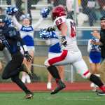 Thunder Mountain's Jacob Tapia, left, returns an interception for a touchdown against Kenai High School at TMHS on Aug 26. Kenai won the game 23-12.