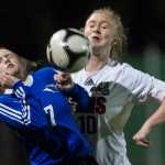 Thunder Mountain's Raye Coffee, left, and Juneau-Douglas' Erika Holst compete for the ball at Adair-Kennedy Memorial Park on April 8.