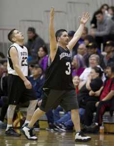 Metlakatla's Gogert celebrates Metlakatla's last-second win as Yakutat's Ralph Johnson reacts to the loss during their "C" bracket game in the 2016 Juneau Lions Club 70th Gold Medal Basketball Tournament at Juneau-Douglas High School on March 21.