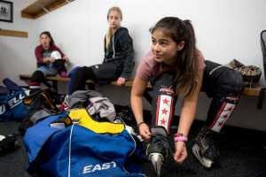 Kaylee Lahnum, 13, laces up her ice skates before the Juneau Douglas Ice Association 10U girls hockey game against the 10U boys team on Dec. 17, 2016 at the Treadwell Arena. The 10U boys team won 7-5.