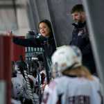 Juneau Douglas Ice Association 10U girls hockey head coach Jill Weitz speaks to her team as assistant coach Greg Stopher looks on during the hockey game against the 10U boys team on Dec. 17, 2016 at the Treadwell Arena. The 10U boys team won 7-5.