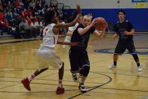 Thunder Mountain senior Chase Saviers gathers the ball in the lane at Saturday's home game against West Valley. Saviers finished with 22 points.