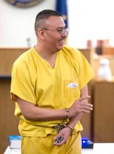 Thomas Jack Jr. waves to family members and friends attending his hearing in Juneau Superior Court on Tuesday, Jan. 10, 2017. Juneau Superior Court Judge Philip Pallenberg ruled to send sentencing of Jack Jr. to a three-judge panel review during the hearing on Tuesday. Jack, 40, was convicted by a Juneau jury during a 2010 trial on six felony counts of sexually assaulting a minor - his then 11-year-old foster daughter. The child and her younger sister had begun living with the Jack family in Hoonah in summer 2007.