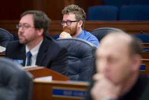 Rep. Justin Parish, D-Juneau, center, watches a practice session in the House of Representatives with other new legislators at the Capitol on Friday, Jan. 13, 2017.