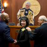 Sen. David Wilson, R-Wasilla, left, and Sen. John Coghill, R-North Pole, right, congratulate Sen. Shelley Hughes, R-Palmer, after being sworn-in by Lt. Gov. Byron Mallott on the first day of the first session of 30th Alaska Legislature at the Capitol in Juneau on Tuesday.