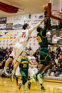 JDHS forward Bryce Swofford attempts to block a Service player's shot on Saturday at JDHS.