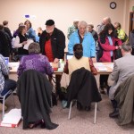 Volunteers check voters' identification at the Republican Presidential Preference Poll on March 1, 2016 in Centennial Hall's Egan Ballroom.