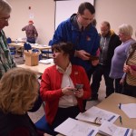 Connie McKenzie, organizer of the Juneau polling station for the Republican Presidential Preference Poll, checks the results March 1, 2016 after the end of polling in Centennial Hall's Egan Ballroom.