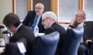 Rep. Craig Johnson, R-Anchorage, chair of the House Rules Committee, meets with other committee members to consider HB 247 at the Bill Ray Center on Tuesday. The bill contains cuts to oil and gas subsidies to industry. Seen with Rep. Johnson are: Speaker of the House Mike Chenault, R-Nikiski, right, Rep. Bob Herron, D-Bethel, center, and House Minority Leader Chris Tuck, D-Anchorage.