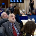 Rep. Bob Herron, D-Bethel, left, and Rep. Bob Lynn, R-Anchorage, center, watch the resolution vote to continue work on bills during the special session on Tuesday.