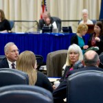House lawmakers talk before a resolution vote to continue work on bills during the special session on Tuesday.