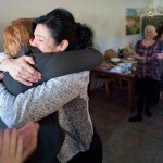 Kara Nelson, director of the Haven House, right, hugs Juneau Police Department Lt. Kris Sell during remarks before the signing of Senate Bill 91, an omnibus criminal law and procedure bill, into law by Gov. Bill Walker at Haven House on Monday.