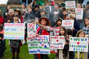 About 100 people attend a rally at Twin Lakes Wednesday evening in solidarity with the Standing Rock Sioux Tribe in North Dakota over the construction of the 1,172-mile Dakota Access pipeline.