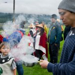 Andrew Stephenson starts a smudge pot to burn cedar for a blessing as about 100 people attend a rally at Twin Lakes Wednesday evening in solidarity with the Standing Rock Sioux Tribe in North Dakota over the construction of the 1,172-mile Dakota Access pipeline.