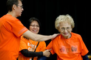 Teacher Hans Chester, left, and Barbara Cadiente-Nelson, center, thank elder Selina Everson for speaking to students, teachers and parents celebrating Orange Shirt Day in the Elizabeth Peratrovich Hall on Friday.