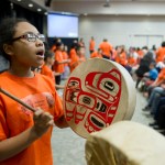 Harborview Elementary School fifth-grader Remi Starks drums during Orange Shirt Day in the Elizabeth Peratrovich Hall on Friday.