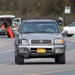 Juneau Police Department officers investigate the site of vehicle/pedestrian accident in the Lemon Creek area on Friday.