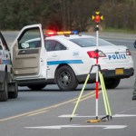 Juneau Police Department officers investigate the site of vehicle/pedestrian accident in the Lemon Creek area on Friday.