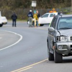 Juneau Police Department officers investigate the site of vehicle/pedestrian accident in the Lemon Creek area on Friday.