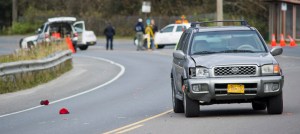 Juneau Police Department officers investigate the site of vehicle/pedestrian accident in the Lemon Creek area on Friday.