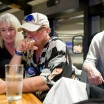 Rep. Cathy Muñoz and her husband, Juan, right,watch national and state elections results with Don Kubley, center, during a party at the Canton Asian Bistro on Tuesday.