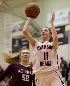 JDHS' Kendyl Carson attempts a layup with Kayhi defender Payton Simmons looking on.