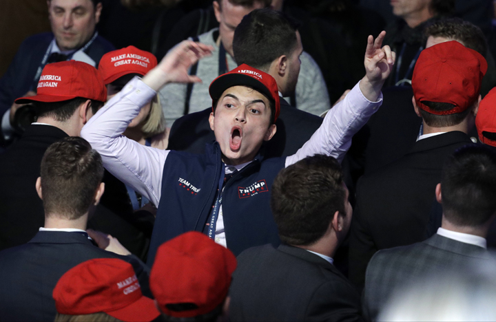 Supporters of Republican presidential candidate Donald Trump react as they watch the election results during Trump's election night rally Tuesday in New York.