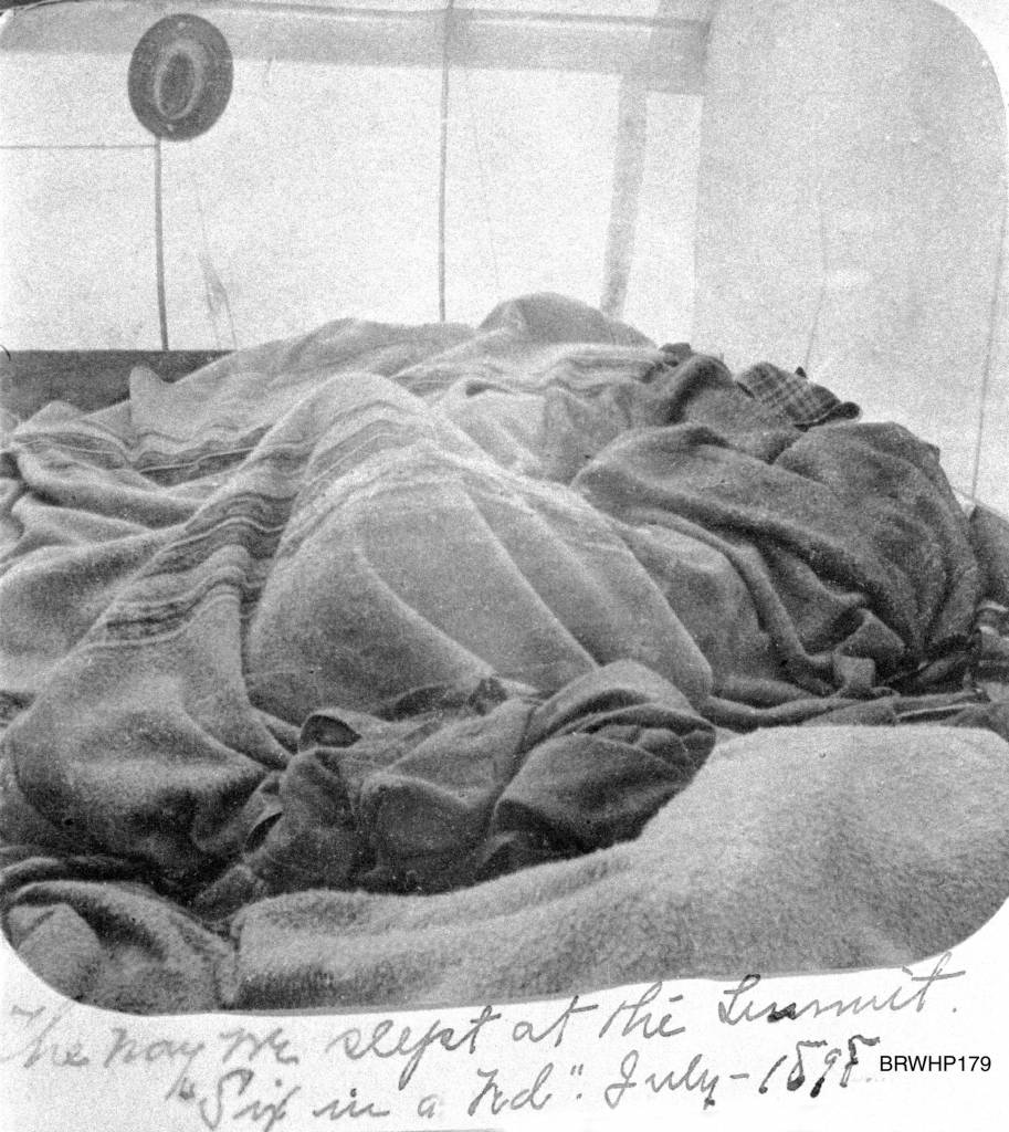 The way we slept at the Summit, six in a bed. The Brackett family asleep in a tent at the summit of the White Pass Trail some 20 miles north of Skagway, circa July 1898. (Courtesy Photo | National Park Service, Klondike Gold Rush National Historical Park, Brackett Family Collection, BRWHP179, KLGO WS-58-5311)