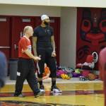 Carlos Boozer works with coach George Houston at his basketball camp last August at the Juneau-Douglas High School gym. (Nolin Ainsworth | Juneau Empire File)