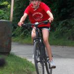 Emma Fellman, 11, rides in the Douglas Dirt Derby on Saturday, Aug. 4, 2018 at Savikko Park in Douglas. Fellman finished second in her age group, and the event raised about $6,000 for the American Diabetes Association. (Alex McCarthy | Juneau Empire)