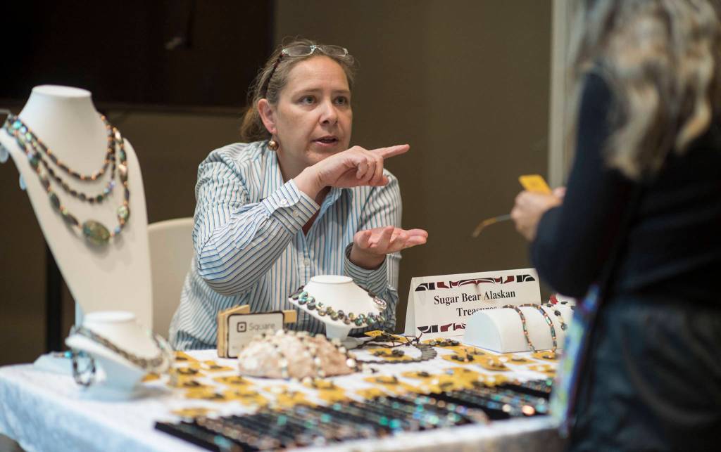 Renee Culp shows her jewelery at the Soboleff Center during First Friday. (Michael Penn | Capital City Weekly)