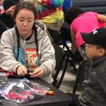 Rose Willard<span class='IDappliedStyle' title='InDesign: Book'> | Courtesy Photo</span>                                Sydney Johnson helps her brother Tristan with an art project at an Alaska Native culture camp on Thursday, Aug. 2.